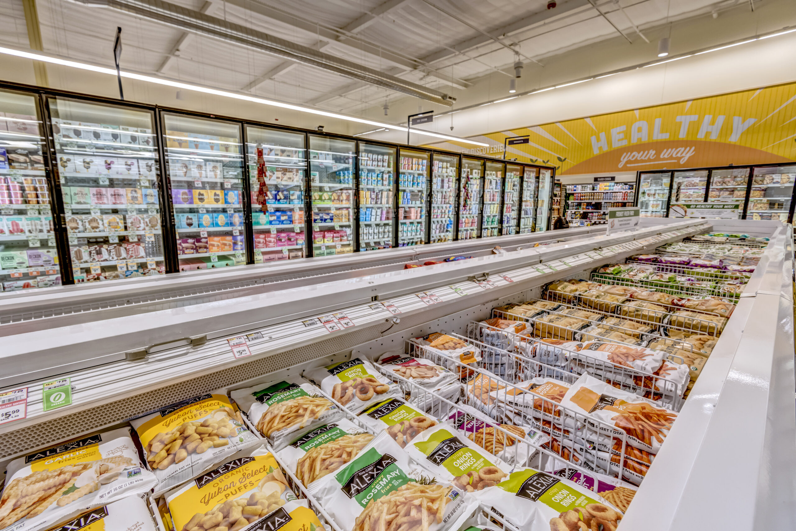 Frozen section of Sprouts Farmers Market, displaying frozen meals and refrigerated foods.